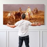 Arabs Watering Their Horses by Adolf Schreyer — single-panel canvas shown behind a standing person for scale