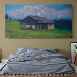 Brenta Mountains and Alpine Cabin by Andreas Roth — single-panel canvas above a bed with blue bedding