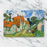 Street in Auvers sur Oise canvas artwork displayed on a marble background