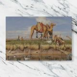 Camels on the Banks of the Nile canvas artwork displayed on a marble background