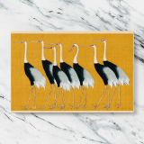 Japanese Cranes on Gold canvas artwork displayed on a marble background