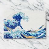 The Great Wave off Kanagawa on White canvas artwork displayed on a marble background
