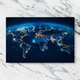 Earth at Night World Map canvas artwork displayed on a marble background
