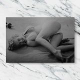 Marilyn Monroe Reclining Black and White Portrait canvas artwork displayed on a marble background