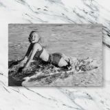Marilyn Monroe at the Beach canvas artwork displayed on a marble background