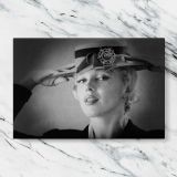 Marilyn Monroe Wearing a Hat canvas artwork displayed on a marble background