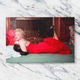 Marilyn Monroe Reclining in a Red Dress canvas artwork displayed on a marble background