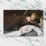 Marilyn Monroe Reclining in a Black Dress canvas artwork displayed on a marble background