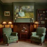Country Couple beneath an Oak Tree canvas wall art in room setting 7