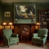 Classical Woman and Cherubs beside a Stream canvas wall art in room setting 7