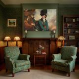 Cavalry Officer beside a Chestnut Horse canvas wall art in room setting 7