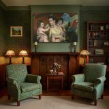 Mother and Children beneath a Red Parasol canvas wall art in room setting 7
