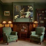 Classical Women beneath an Ornate Canopy canvas wall art in room setting 7