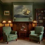 Sailing Boat beneath Storm Clouds canvas wall art in room setting 7