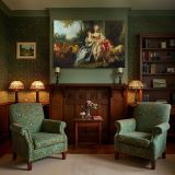 Two Women with Flowers and Sheep canvas wall art in room setting 7