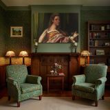 Woman in a Gold and Rose Dress canvas wall art in room setting 7