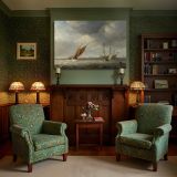 Sailing Boats beneath Rolling Clouds canvas wall art in room setting 7