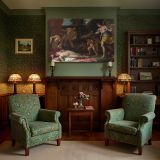 Classical Figures and Cherubs in a Garden canvas wall art in room setting 7