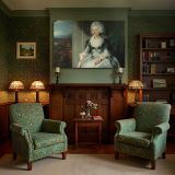 Seated Woman in a Pale Blue Dress canvas wall art in room setting 7
