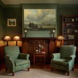 Fishermen on a Windswept Beach canvas wall art in room setting 7
