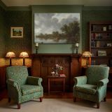 Quiet Riverbank with Trees and Boats canvas wall art in room setting 7