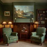 Historic River Town and Boats canvas wall art in room setting 7