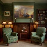 Tall Sailing Ship beneath a Colourful Sky canvas wall art in room setting 7