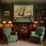 Tall Sailing Ship in Warm Light canvas wall art in room setting 7