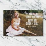 Marilyn Monroe in a Pink Dress with Quote canvas artwork displayed on a marble background
