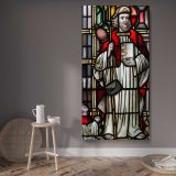 Saint in a Stained Glass Window canvas wall art displayed in a contemporary room