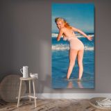 Marilyn Monroe Paddling at the Beach canvas wall art displayed in a contemporary room