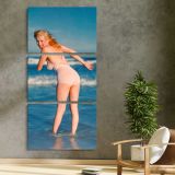 Marilyn Monroe Paddling at the Beach three panel canvas print in a contemporary interior