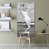 Marilyn Monroe in a White Swimsuit canvas wall art shown in a modern interior