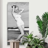Marilyn Monroe in a White Swimsuit canvas print displayed in a modern interior