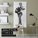 Marilyn Monroe Playing Guitar canvas wall art shown in a modern interior