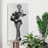 Marilyn Monroe Playing Guitar canvas print displayed in a modern interior