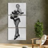 Marilyn Monroe Playing Guitar three panel canvas print in a contemporary interior