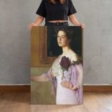 Woman Holding Purple Flowers by Lilla Cabot Perry canvas print, held for scale