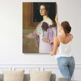 Woman Holding Purple Flowers by Lilla Cabot Perry canvas print, displayed on a wall