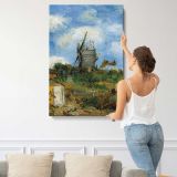 Windmill beneath a Blue Sky by Vincent Van Gogh canvas print, displayed on a wall