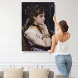 Woman Wearing a Bracelet by Alfred Stevens canvas print, displayed on a wall