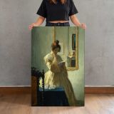 The Letter canvas print, held for scale