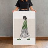 Woman Walking in a Green Jumper canvas print, held for scale
