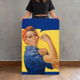 Woman Flexing in Blue Workwear canvas print, held for scale