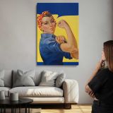 Woman Flexing in Blue Workwear canvas print, room display