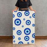 Blue Evil Eye Pattern on Cream canvas print, held for scale