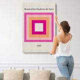 Pink and Orange Concentric Squares canvas print, displayed on a wall