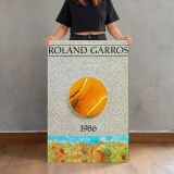 Roland Garros 1986 Tennis Ball canvas print, held for scale