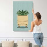 Succulent in a Woven Planter canvas print, displayed on a wall
