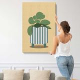 Green Houseplant in a Striped Pot canvas print, displayed on a wall